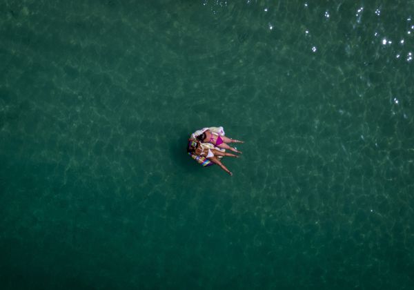 Two women lay on a float on a beach in southwest Grand Canary island, Spain, Wednesday 19 August 2020. - Sputnik International