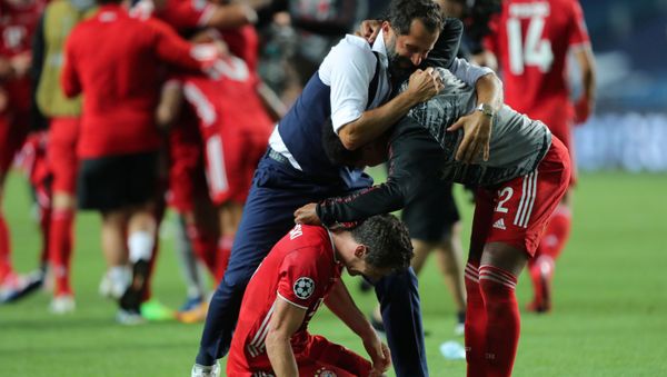 Soccer Football - Champions League - Final - Bayern Munich v Paris St Germain - Estadio da Luz, Lisbon, Portugal - August 23, 2020  Bayern Munich's Robert Lewandowski celebrates winning the Champions League with Sport Director Hasan Salihamidzic and Serge Gnabry, as play resumes behind closed doors following the outbreak of the coronavirus disease (COVID-19)  - Sputnik International