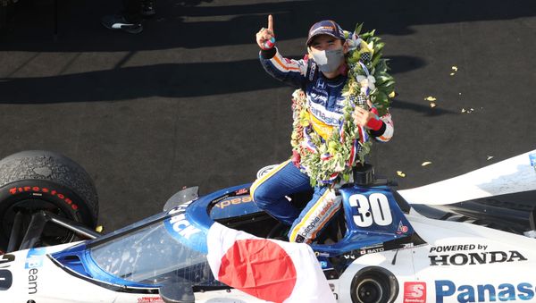 Aug 23, 2020; Indianapolis, Indiana, USA; IndyCar driver Takuma Sato (30) reacts in victory lane after winning the 104th running of the Indianapolis 500 at the Indianapolis Motor Speedway. - Sputnik International