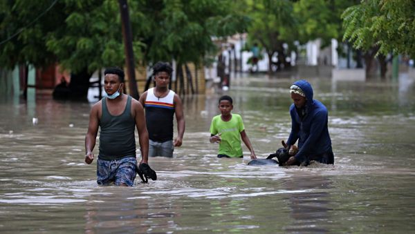 People move their animals through the floods caused by the passage of Storm Laura in Azua, Dominican Republic August 23, 2020. - Sputnik International