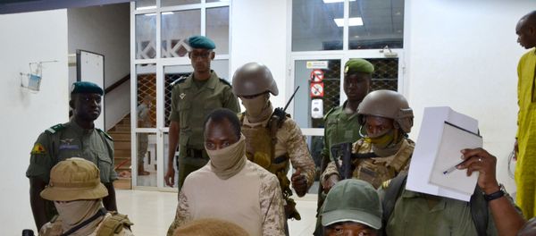 Colonel Assimi Goita, the junta leader of the National Committee for the Salvation of the People (CNSP) which overthrew Mali's President Ibrahim Boubacar Keita, walks out after the meeting with Economic Community of West African States (ECOWAS) mediators in Bamako, Mali August 23, 2020. Colonel Assimi Goita, the junta leader of the National Committee for the Salvation of the People (CNSP) which overthrew Mali's President Ibrahim Boubacar Keita, walks out after the meeting with Economic Community of West African States (ECOWAS) mediators in Bamako, Mali August 23, 2020. - Sputnik International