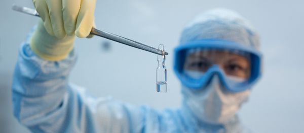 A handout photo shows an employee demonstrating a vial with Gam-COVID-Vac vaccine against the coronavirus disease (COVID-19), developed by the Gamaleya National Research Institute of Epidemiology and Microbiology and the Russian Direct Investment Fund (RDIF), during its production at Binnopharm pharmaceutical company in Zelenograd near Moscow, Russia August 7, 2020 - Sputnik International