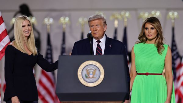 U.S. President Donald Trump looks on alongside to U.S. first lady Melania Trump and White House Senior Adviser Ivanka Trump before delivering his acceptance speech as the 2020 Republican presidential nominee during the final event of the Republican National Convention on the South Lawn of the White House in Washington, U.S., August 27, 2020.  - Sputnik International