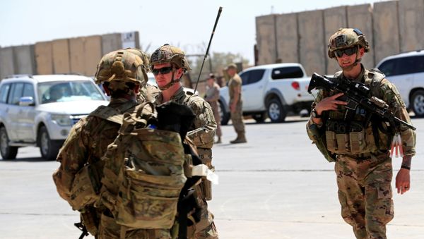 U.S. soldiers are seen during a handover ceremony of Taji military base from US-led coalition troops to Iraqi security forces, in the base north of Baghdad, Iraq August 23, 2020. REUTERS/Thaier Al-Sudani - Sputnik International