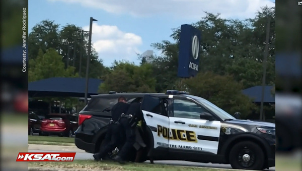 KSAT video from Jennifer Rodriguez showing the arrest of a Black men who cops mistook for an assault suspect KSAT video from Jennifer Rodriguez showing the arrest of a Black men who cops mistook for an assault suspect - Sputnik International