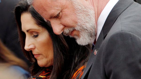Liberty University President Jerry Falwell Jr. and his wife Becki Tilley bow their heads in a prayer after commencement ceremonies at Liberty University in Lynchburg, Virginia, U.S., May 11, 2019.   - Sputnik International
