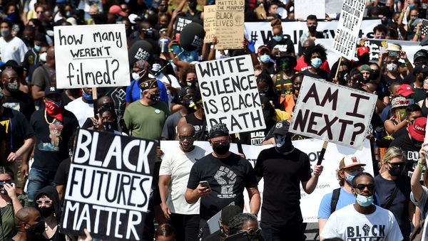 People holding placards attend the 'Get Your Knee Off Our Necks' march in support of racial justice, in Washington, U.S., August 28, 2020 - Sputnik International