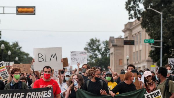 People march with signs, following the police shooting of Jacob Blake, a Black man, in Kenosha - Sputnik International