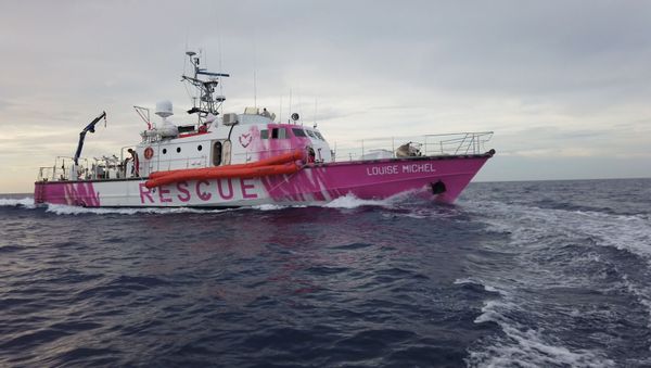 In this undated still image taken from video, the Louise Michel, a migrants search and rescue ship operating in the Mediterranean and financed by British street artist Banksy, is seen at sea - Sputnik International
