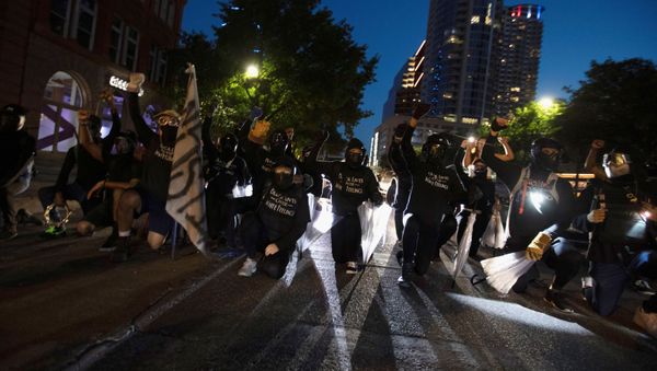 Black Lives Matter protesters block Congress Avenue at a march in Austin, Texas, U.S., August 1, 2020. Members of the Boogaloo Boys and the Texas Guerrillas also appeared at the rally saying they wanted to protect protesters and their right to free speech. Picture taken August 1, 2020 - Sputnik International