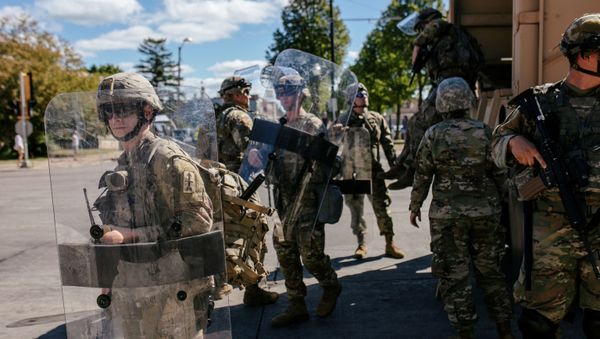 National Guard officers unload an armoured vehicle filled with soldiers outside of the Kenosha County Courthouse during a Blue Lives Matter rally organized by supporters of law enforcement officers, a week after Black man Jacob Blake was shot several times by police in Kenosha, Wisconsin, U.S., August 30, 2020. National Guard officers unload an armoured vehicle filled with soldiers outside of the Kenosha County Courthouse during a Blue Lives Matter rally organized by supporters of law enforcement officers, a week after Black man Jacob Blake was shot several times by police in Kenosha, Wisconsin, U.S., August 30, 2020. - Sputnik International