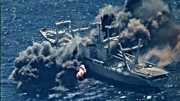 Live fire from ships and aircraft participating in the Rim of the Pacific (RIMPAC) exercise sink the decommissioned amphibious cargo ship ex-USS Durham (LKA 114) August 30. - Sputnik International