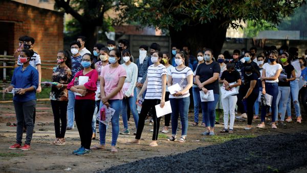 Students wearing protective face masks wait to enter an examination centre for Joint Entrance Examination (JEE), amidst the spread of the coronavirus disease (COVID-19), in Ahmedabad, India, September 1, 2020 Students wearing protective face masks wait to enter an examination centre for Joint Entrance Examination (JEE), amidst the spread of the coronavirus disease (COVID-19), in Ahmedabad, India, September 1, 2020 - Sputnik International