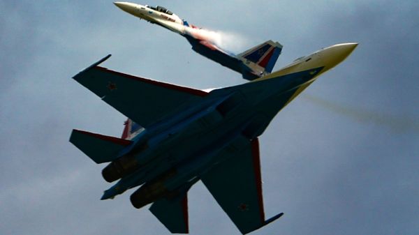 Su-35C jets of the Russian Knights aerobatic team perform a demonstration flight at the Army-2020 forum outside Moscow.  - Sputnik International