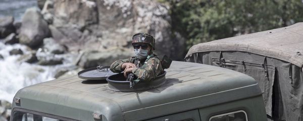An Indian army soldier keeps guard on top of his vehicle as their convoy moves on the Srinagar- Ladakh highway at Gagangeer, northeast of Srinagar, Indian-controlled Kashmir, Tuesday, Sept. 1, 2020 - Sputnik International