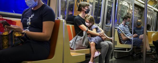 A child rests on a subway car while riders wear protective masks due to COVID-19 concerns, Monday, Aug. 17, 2020, in New York. A child rests on a subway car while riders wear protective masks due to COVID-19 concerns, Monday, Aug. 17, 2020, in New York. - Sputnik International