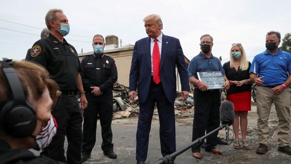 FILE PHOTO: U.S. President Donald Trump talks to reporters as he stands with Kenosha police and business people while examining property damage to a business while visiting the city in the aftermath of recent protests against police brutality and racial injustice and ensuing violence after the shooting of Jacob Blake by a police officer in Kenosha, Wisconsin, U.S., September 1, 2020 FILE PHOTO: U.S. President Donald Trump talks to reporters as he stands with Kenosha police and business people while examining property damage to a business while visiting the city in the aftermath of recent protests against police brutality and racial injustice and ensuing violence after the shooting of Jacob Blake by a police officer in Kenosha, Wisconsin, U.S., September 1, 2020 - Sputnik International