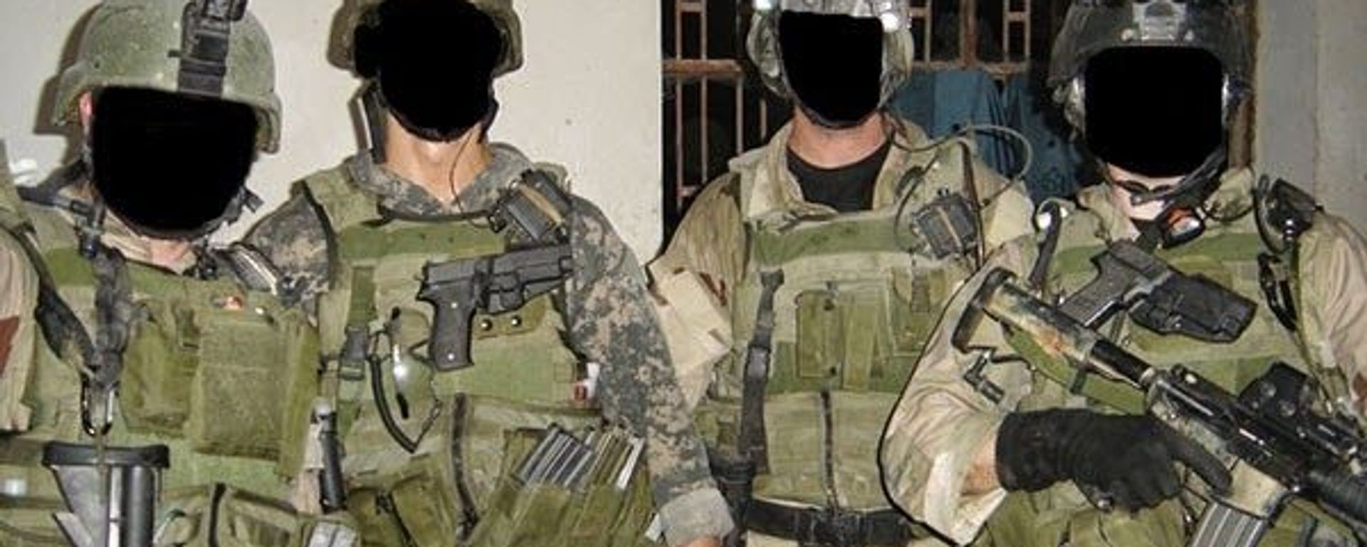 Four mercenaries belonging to Keenie Meenie Services with faces blacked out - Sputnik International, 1920, 01.09.2023
