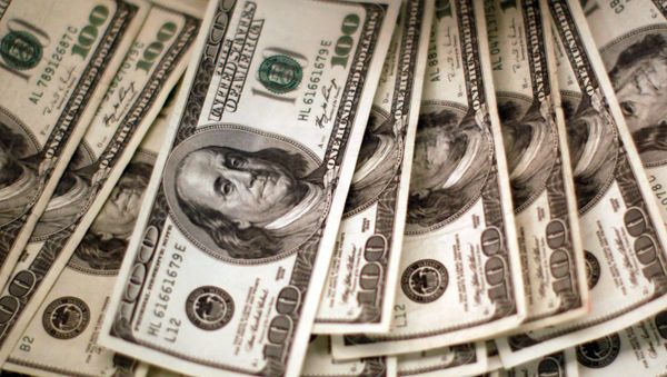 U.S. dollars are counted out by a banker counting currency at a bank in Westminster, Colorado November 3, 2009.  - Sputnik International