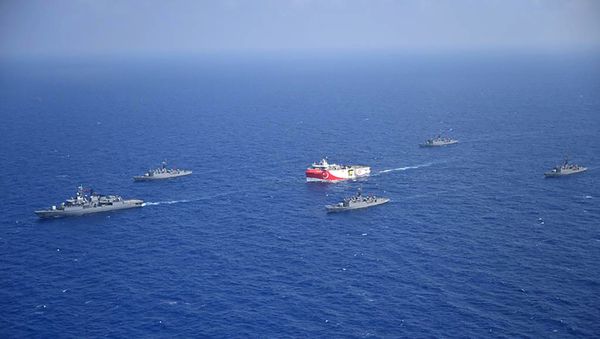 This handout photograph released by the Turkish Defence Ministry on August 12, 2020, shows Turkish seismic research vessel 'Oruc Reis' (C) as it is escorted by Turkish Naval ships in the Mediterranean Sea, off Antalya on August 10, 2020. - Sputnik International