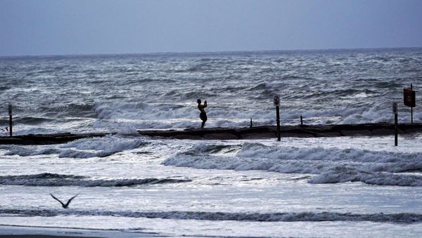Cody Cloud takes a picture of the waves Wednesday, Aug. 26, 2020, in Galveston, Texas, as Hurricane Laura moves toward the Gulf Coast.  Forecasters say Laura is rapidly intensifying and will become a “catastrophic” Category 4 hurricane before landfall. It's churning toward Texas and Louisiana, gathering wind and water that swirls over much of the Gulf of Mexico. - Sputnik International