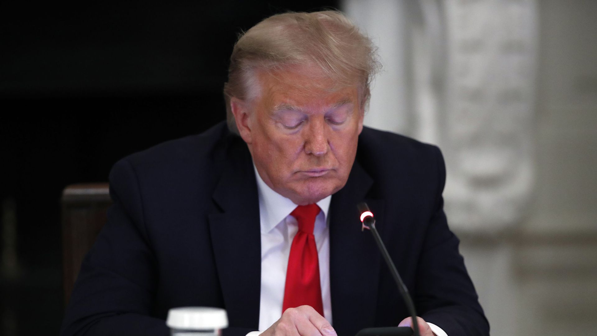 President Donald Trump looks at his phone during a roundtable with governors on the reopening of America's small businesses, in the State Dining Room of the White House, Thursday, June 18, 2020, in Washington President Donald Trump looks at his phone during a roundtable with governors on the reopening of America's small businesses, in the State Dining Room of the White House, Thursday, June 18, 2020, in Washington - Sputnik International, 1920, 10.02.2021