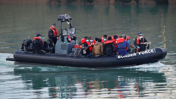 Migrants are brought to Dover harbour by Border Force, in Dover, Britain August 12, 2020 Migrants are brought to Dover harbour by Border Force, in Dover, Britain August 12, 2020 - Sputnik International