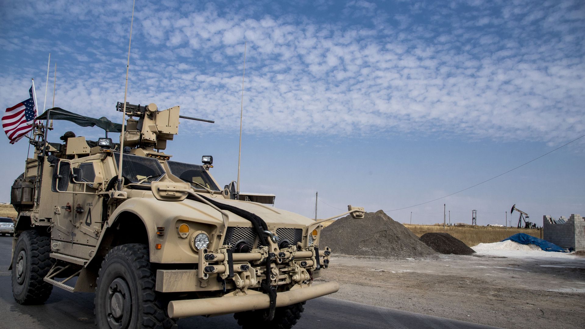 FILE - In this Monday, Oct. 28, 2019 file photo, U.S. forces patrol Syrian oil fields, in eastern Syria.President Donald Trump's decision to dispatch new U.S. forces to eastern Syria to secure oil fields is being criticized by some experts as ill-defined and ambiguous. But the residents of the area, one of the country's most remote and richest regions, hope the U.S. focus on eastern Syria would bring an economic boon and eliminate what remains of the Islamic State group FILE - In this Monday, Oct. 28, 2019 file photo, U.S. forces patrol Syrian oil fields, in eastern Syria.President Donald Trump's decision to dispatch new U.S. forces to eastern Syria to secure oil fields is being criticized by some experts as ill-defined and ambiguous. But the residents of the area, one of the country's most remote and richest regions, hope the U.S. focus on eastern Syria would bring an economic boon and eliminate what remains of the Islamic State group - Sputnik International, 1920, 19.03.2021