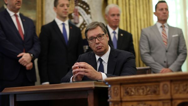 Serbia's President Aleksandar Vucic listens as U.S. President Donald Trump speaks during a signing ceremony with Kosovo's Prime Minister Avdullah Hoti at the White House in Washington, U.S., September 4, 2020. - Sputnik International