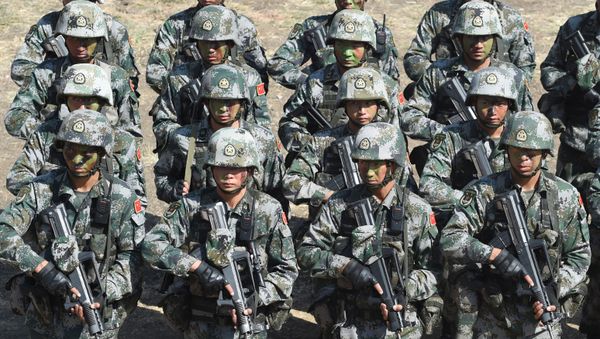 People's Liberation Army (PLA) of China soldiers line up after participating in an anti-terror drill during the Sixth India-China Joint Training exercise Hand in Hand 2016 at HQ 330 Infantry Brigade, in Aundh in Pune district, some 145km southeast of Mumbai, on November 25, 2016. People's Liberation Army (PLA) of China soldiers line up after participating in an anti-terror drill during the Sixth India-China Joint Training exercise Hand in Hand 2016 at HQ 330 Infantry Brigade, in Aundh in Pune district, some 145km southeast of Mumbai, on November 25, 2016. - Sputnik International