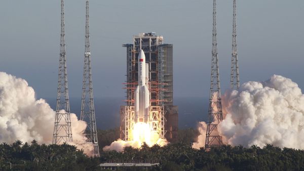 In this May 5, 2020, file photo released by Xinhua News Agency, China's new large carrier rocket Long March 5B blasts off from the Wenchang Space Launch Center in southern China's Hainan Province. An experimental version of China’s latest-generation crewed shape ship is operating normally, the government says, despite an apparent malfunction aboard a cargo return capsule. - Sputnik International
