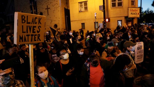 Demonstrators hold signs reading Black Lives Matter during a protest over the death of a Black man, Daniel Prude, after police put a spit hood over his head during an arrest on March 23, in Rochester, New York, U.S. September 6, 2020. - Sputnik International
