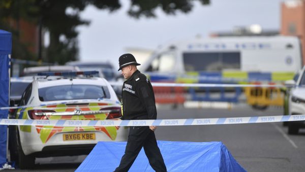 A police officer and vehicles are seen at a cordon in Irving Street in Birmingham after a number of people were stabbed in the city centre, Sunday, Sept. 6, 2020. - Sputnik International
