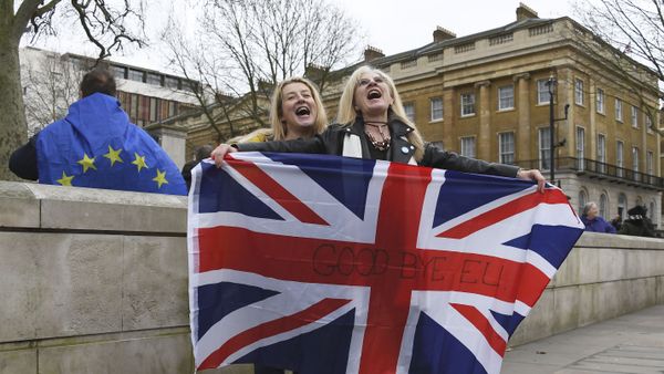 Brexit supporters hold the Union Jack with a text reading Goodbye EU as they celebrate next to a person wearing the EU flag in London, Friday, Jan. 31, 2020 Brexit supporters hold the Union Jack with a text reading Goodbye EU as they celebrate next to a person wearing the EU flag in London, Friday, Jan. 31, 2020 - Sputnik International