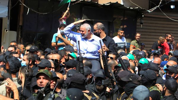 Palestinian group Hamas' top leader, Ismail Haniyeh, gestures as he is carried during his visit at Ain el Hilweh Palestinian refugee camp in Sidon, Lebanon September 6, 2020 - Sputnik International
