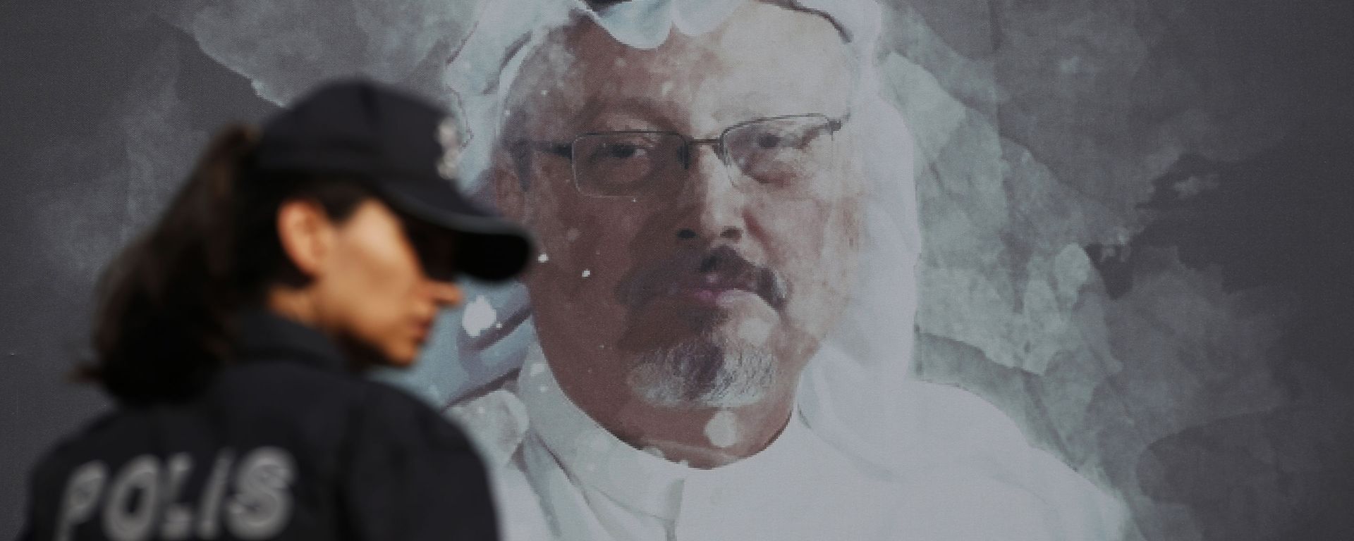 A Turkish police officer walks past a picture of slain Saudi journalist Jamal Khashoggi prior to a ceremony, near the Saudi Arabia consulate in Istanbul, marking the one-year anniversary of his death, 2 October 2019 A Turkish police officer walks past a picture of slain Saudi journalist Jamal Khashoggi prior to a ceremony, near the Saudi Arabia consulate in Istanbul, marking the one-year anniversary of his death, 2 October 2019 - Sputnik International, 1920, 24.02.2021
