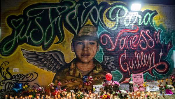 Flowers adorn a mural of Vanessa Guillen, a soldier based at nearby Fort Hood on July 6, 2020 in Austin, Texas. - Sputnik International