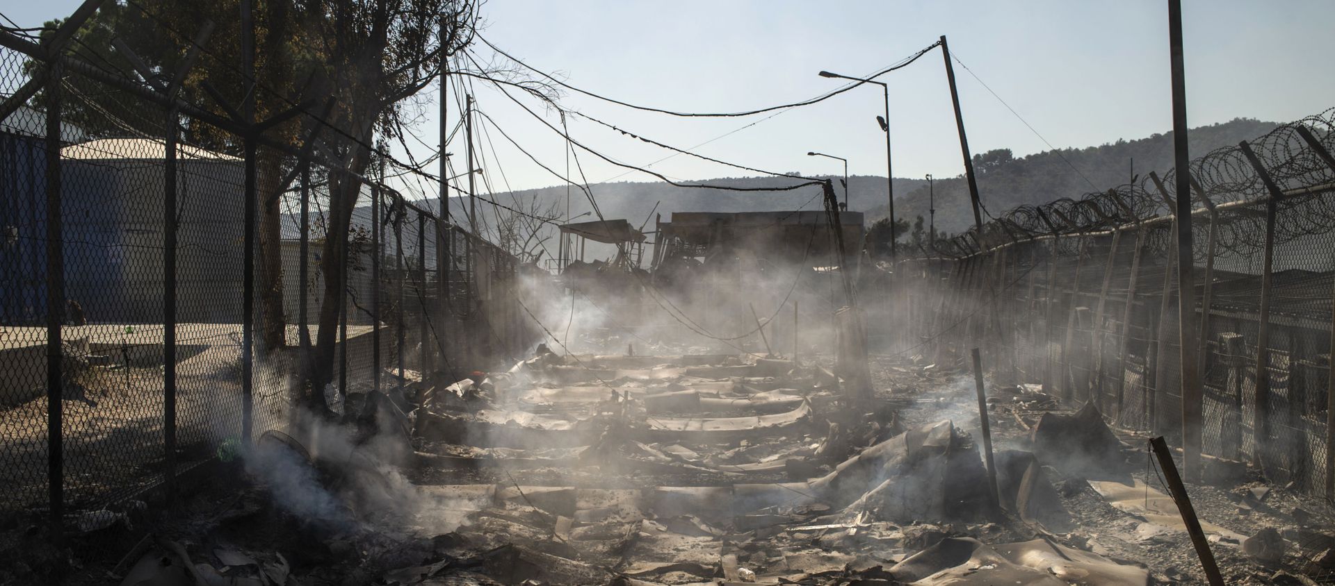 A picture taken on September 9, 2020 shows the burnt camp of Moria on the island of Lesbos after a major fire broke out. - Sputnik International, 1920, 17.09.2020