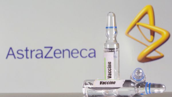 A test tube labelled with the vaccine is seen in front of AstraZeneca logo in this illustration taken 9 September 2020. A test tube labelled with the vaccine is seen in front of AstraZeneca logo in this illustration taken 9 September 2020. - Sputnik International