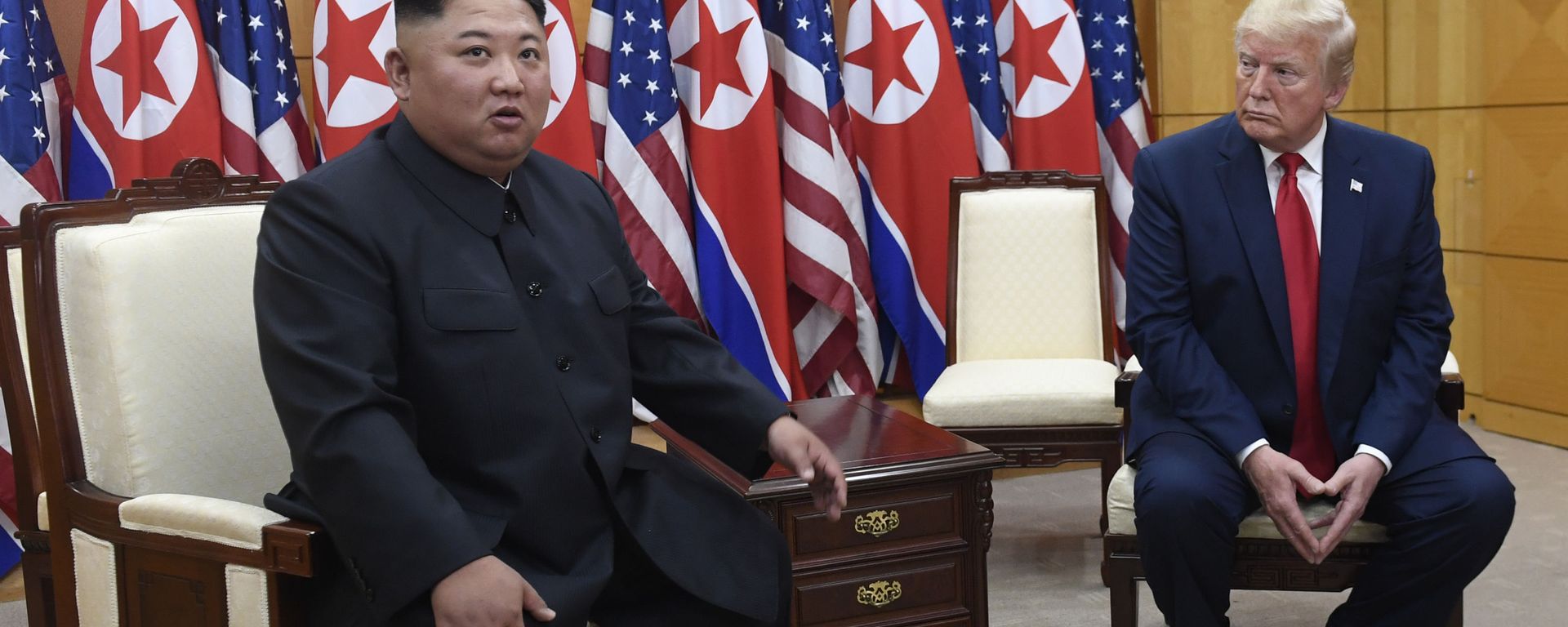In this June 30, 2019, file photo President Donald Trump, right, listens as North Korean leader Kim Jong Un, left, speaks during their bilateral meeting inside the Freedom House at the border village of Panmunjom in the Demilitarized Zone, South Korea In this June 30, 2019, file photo President Donald Trump, right, listens as North Korean leader Kim Jong Un, left, speaks during their bilateral meeting inside the Freedom House at the border village of Panmunjom in the Demilitarized Zone, South Korea - Sputnik International, 1920, 18.09.2021