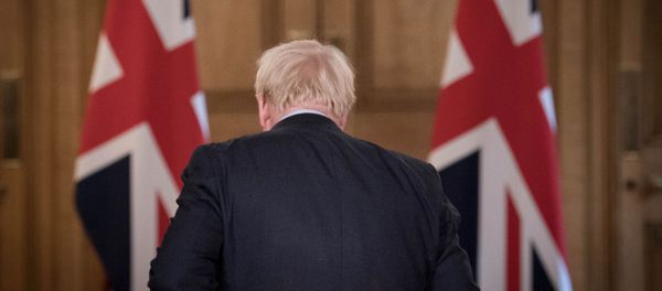 Britain's Prime Minister Boris Johnson is seen at the end of a virtual news conference on the ongoing situation with the coronavirus disease (COVID-19), at Downing Street, London, Britain September 9, 2020. Britain's Prime Minister Boris Johnson is seen at the end of a virtual news conference on the ongoing situation with the coronavirus disease (COVID-19), at Downing Street, London, Britain September 9, 2020. - Sputnik International