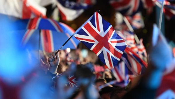 Brexit supporters wave Union flags as the time nears 11 O'Clock, in Parliament Square, venue for the Leave Means Leave Brexit Celebration in central London on January 31, 2020, the moment that the UK formally leaves the European Union. - Sputnik International