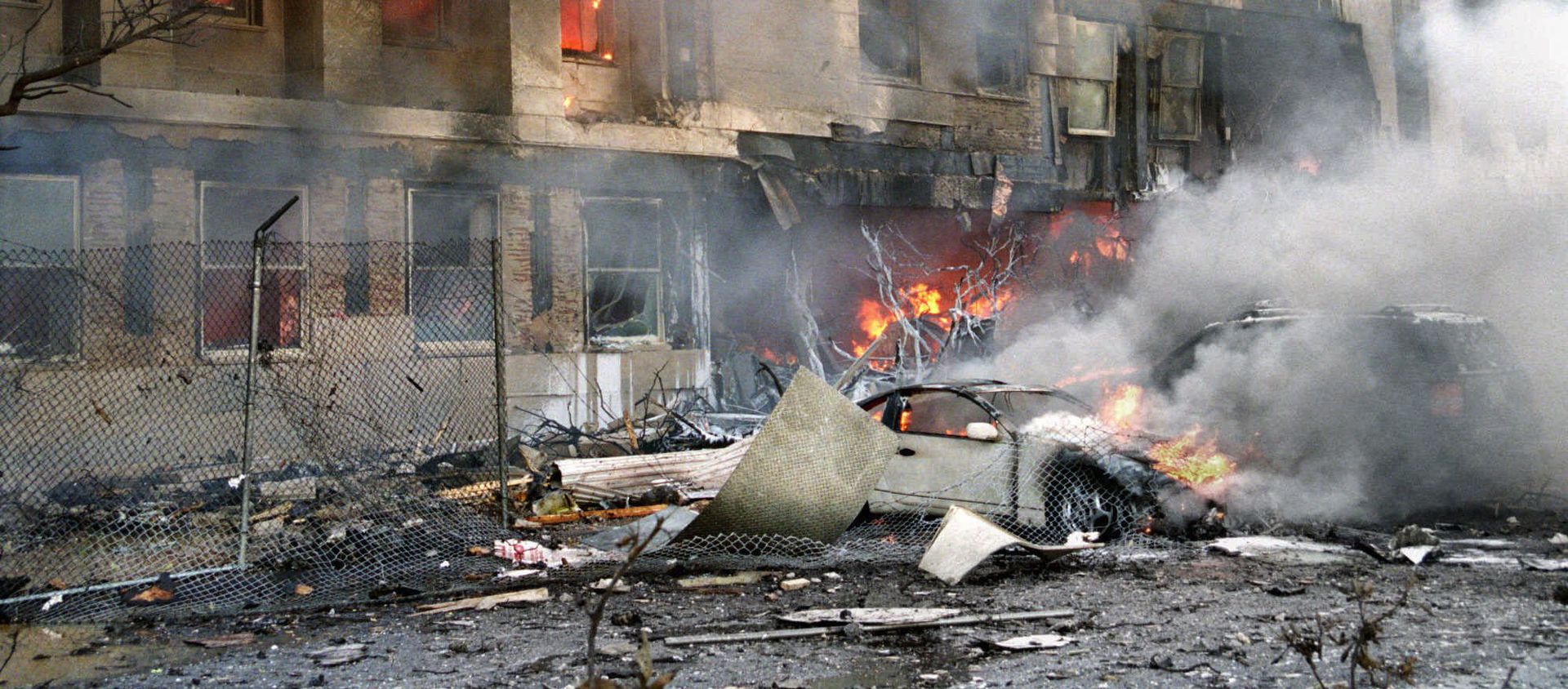 In this 11 September 2001 file photo, damage to the outer ring of the Pentagon is shown after a hijacked airliner crashed into the building - Sputnik International, 1920, 21.08.2021
