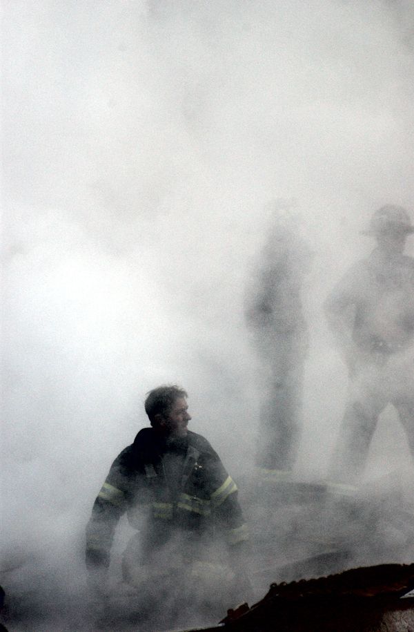 A firefighter emerges from the smoke and debris of the World Trade Center A firefighter emerges from the smoke and debris of the World Trade Center - Sputnik International