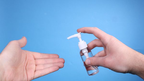 Man hand using wash hand sanitizer gel. Man hand using wash hand sanitizer gel. - Sputnik International
