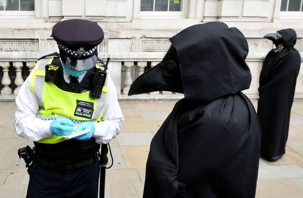 A police officer takes down details of one of the members of the Animal Rebellion group dressed in a costume as they march during an Extinction Rebellion protest in London, Britain, September 8, 2020 A police officer takes down details of one of the members of the Animal Rebellion group dressed in a costume as they march during an Extinction Rebellion protest in London, Britain, September 8, 2020 - Sputnik International