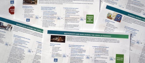 Documents that U.S. health officials have released as part of some long-delayed specific guidance that schools, businesses, and other organizations can use as states reopen from coronavirus shutdowns are photographed Thursday, May 14, 2020. The Centers for Disease Control and Prevention posted a set of six “decision tool” documents. Documents that U.S. health officials have released as part of some long-delayed specific guidance that schools, businesses, and other organizations can use as states reopen from coronavirus shutdowns are photographed Thursday, May 14, 2020. The Centers for Disease Control and Prevention posted a set of six “decision tool” documents. - Sputnik International