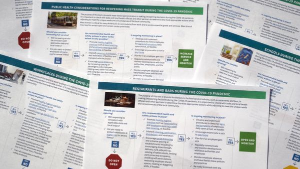 Documents that U.S. health officials have released as part of some long-delayed specific guidance that schools, businesses, and other organizations can use as states reopen from coronavirus shutdowns are photographed Thursday, May 14, 2020. The Centers for Disease Control and Prevention posted a set of six “decision tool” documents. - Sputnik International