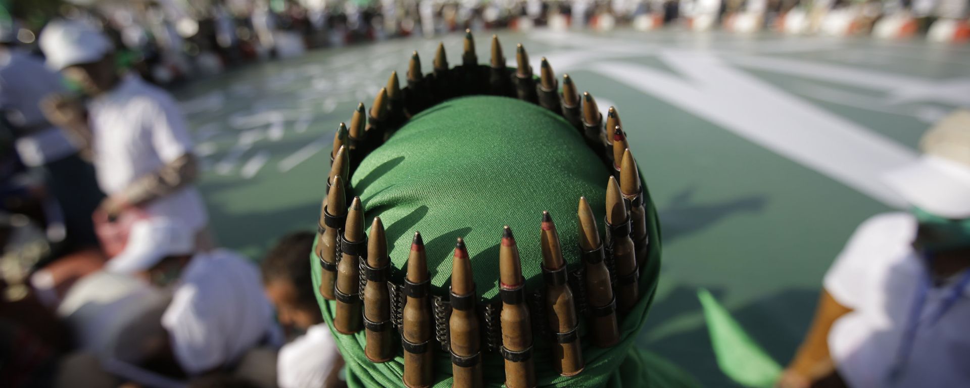 A supporter of Shiite rebels, known as Houthis, with an ammunition belt placed on his head attends a celebration of Moulid al-nabi, the birth of Islam's prophet Muhammad in Sanaa, Yemen, Saturday, Nov. 9, 2019 - Sputnik International, 1920, 03.05.2024
