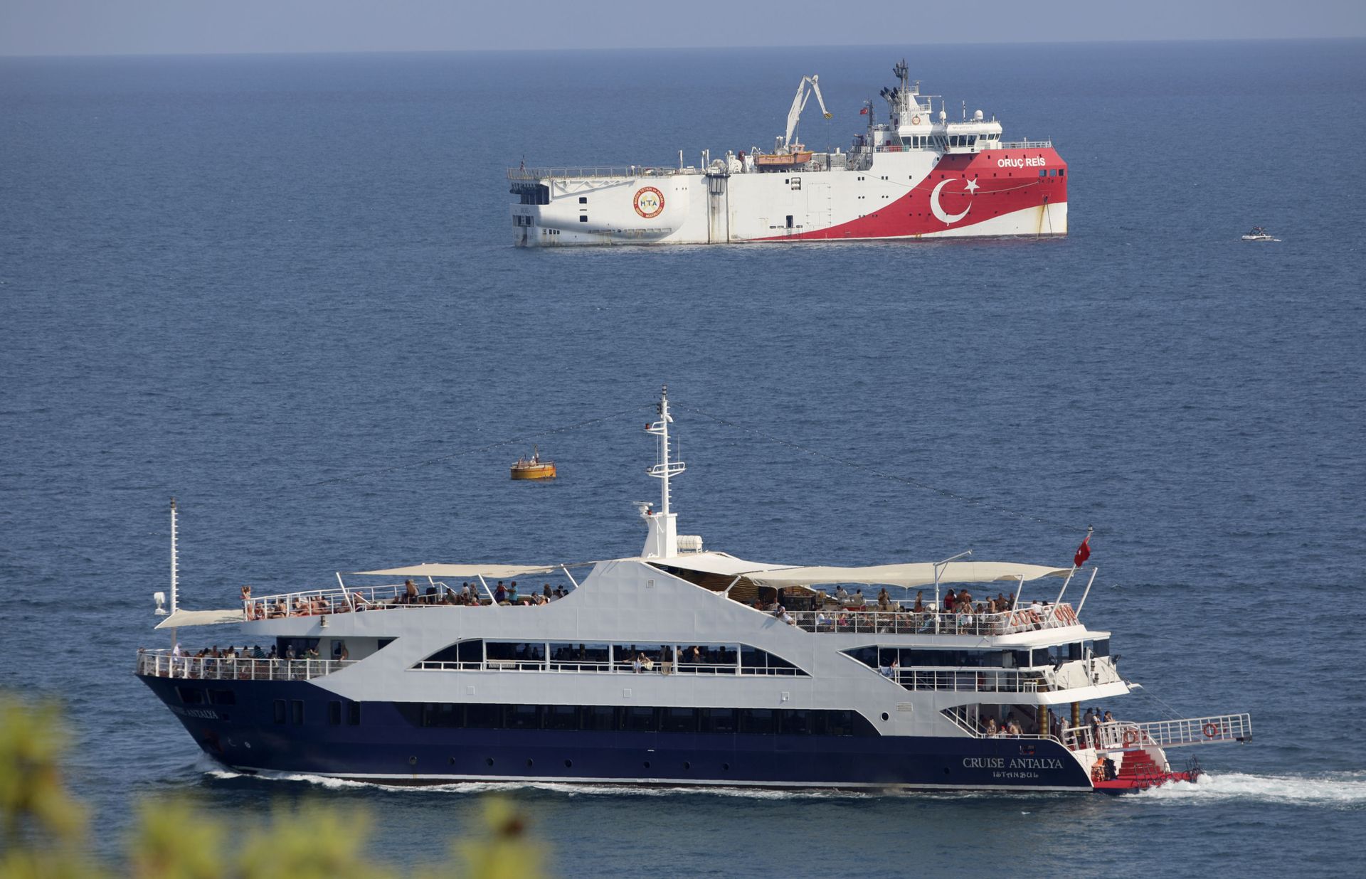 Turkey's research vessel, Oruc Reis, rear, anchored off the coast of Antalya on the Mediterranean, Turkey, Sunday, Sept. 13, 2020. Greece's Prime Minister Kyriakos Mitsotakis welcomed the return of a Turkish survey vessel to port Sunday from a disputed area of the eastern Mediterranean that has been at the heart of a summer stand-off between Greece and Turkey over energy rights. Turkey's research vessel, Oruc Reis, rear, anchored off the coast of Antalya on the Mediterranean, Turkey, Sunday, Sept. 13, 2020. Greece's Prime Minister Kyriakos Mitsotakis welcomed the return of a Turkish survey vessel to port Sunday from a disputed area of the eastern Mediterranean that has been at the heart of a summer stand-off between Greece and Turkey over energy rights. - Sputnik International, 1920, 07.09.2021